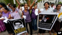 FILE - Sri Lankan women protest in Colombo, Sri Lanka, Jan. 11, 2013, condemning the execution of Sri Lankan domestic worker Rizana Nafeek in Saudi Arabia.