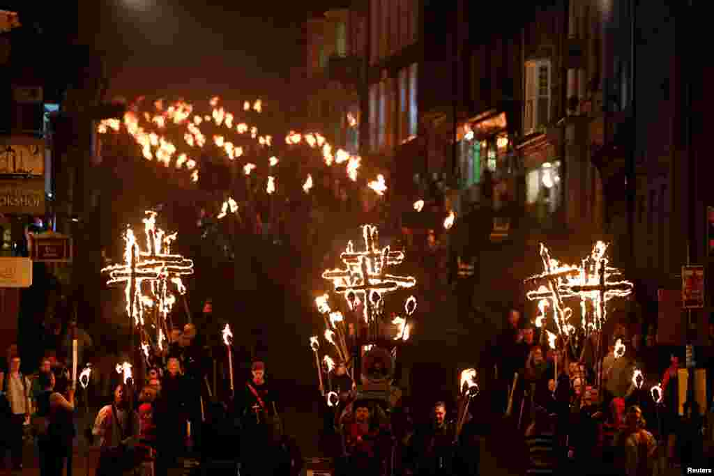Participants parade through the town during the annual Bonfire Night festivities in Lewes, Britain.