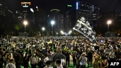 Activists hold a candlelit remembrance in Victoria Park in Hong Kong on June 4, 2020