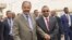 FILE - Eritrean President Isaias Afwerki and Ethiopia's Prime Minister Abiy Ahmed walk together at Asmara International Airport, Eritrea, July 9, 2018.