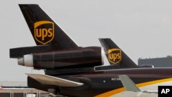 FILE - A UPS aircraft taxis to its hangar area after it arrived at Dallas-Fort Worth International Airport in Grapevine, Texas, June 24, 2019. 