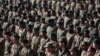 New members of the Afghan National Army attend their graduation ceremony at the Afghan Military Academy in Kabul, Afghanistan, Nov. 23, 2014. 