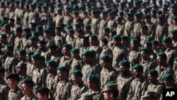 New members of the Afghan National Army attend their graduation ceremony at the Afghan Military Academy in Kabul, Afghanistan, Nov. 23, 2014. 