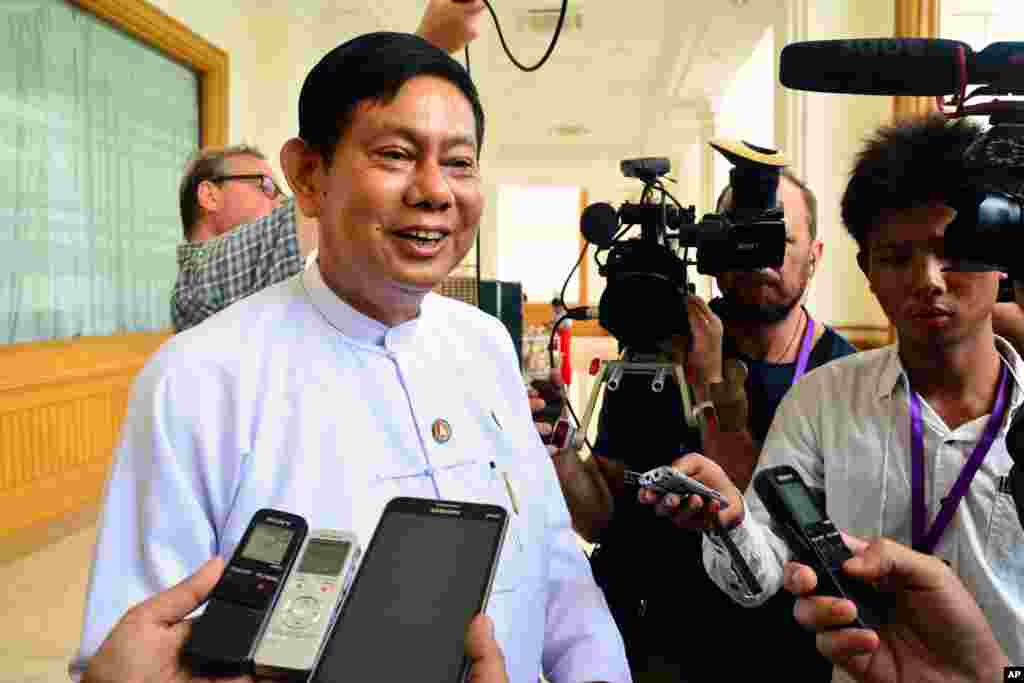 Htay Oo, left, chairman of Union Solidarity and Development Party (USDP), speaks to the media ahead of a regular session at Parliament in Naypyitaw, Myanmar Tuesday, Aug. 18, 2015. Parliament has reopened for its final session before Myanmar&#39;s nationwide election, with a spotlight on the influential speaker following his violent ouster as head of the military-backed ruling party. (AP Photo/Khin Maung Win)