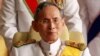 FILE - Thailand's King Bhumibol Adulyadej leaves the Siriraj Hospital for a ceremony at the Grand Palace in Bangkok.