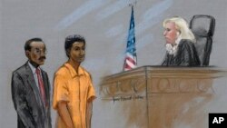 Courtroom sketch shows defendant Robel Phillipos, center, stands with defense attorney Derege Demissie before Federal Magistrate Marianne Bowler, U.S. District Court, Boston, May 6, 2013.