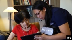Seventy-five year old Eileen Higa can choose the type of virtual reality experience she wants. They range from watching a concert, traveling to a destination, or something more active such as wingsuit flight. (E. Lee)