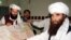 FILE - Jalaluddin Haqqani, right, founder of the Haqqani network, is seen during a visit to Islamabad, Pakistan, Oct. 19, 2001. A speech by one of his sons, Sirajuddin Haqqani, who now heads the network, is drawing renewed attention.