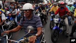 Motorcyclists attend a rally in support of Venezuela's President Nicolas Maduro in Caracas, Venezuela, Feb. 24, 2014. 