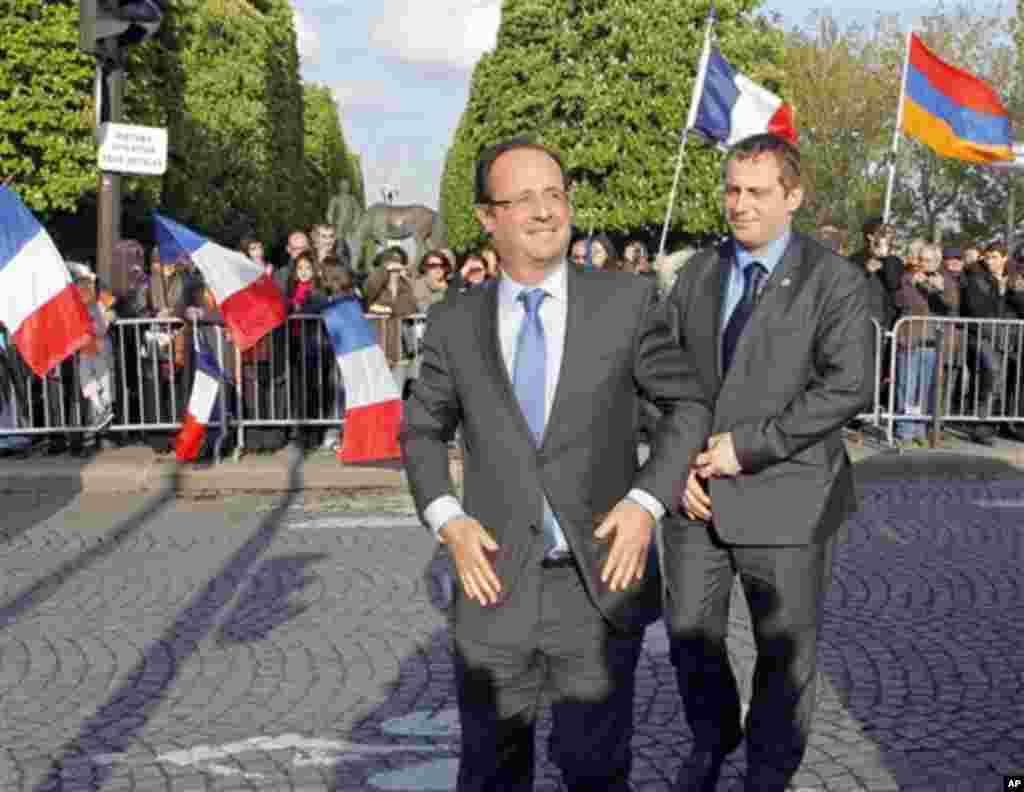 Socialist Party candidate for the presidential election Francois Hollande arrives at their ceremony marking the 97th anniversary of the Armenian genocide, Tuesday, April. 24, 2012. (AP Photo/Jacques Brinon Pool)