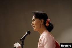 FILE - Myanmar pro-democracy leader Aung San Suu Kyi gives a speech during a World Press Freedom Day ceremony in Yangon, May 3, 2015.