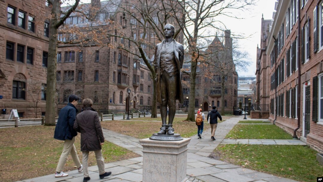 FILE - A statue of Nathan Hale, a Yale University class of 1773 graduate, with his hands and ankles bound with rope and the inscription "I only regret that I have but one life to lose for my country" is in front of Hale's former dormitory Connecticut Hall on Dec. 4, 2023. 