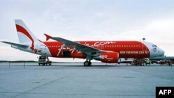 Air Asia mengatakan akan menjadi maskapai pertama di dunia yang memeriksa paspor semua penumpang dan dibandingkan dengan basis data global milik Interpol.