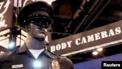 FILE _ Police body cameras are seen on a mannequin at an exhibit booth by manufacturer Wolfcom at the International Association of Chiefs of Police conference in Chicago.