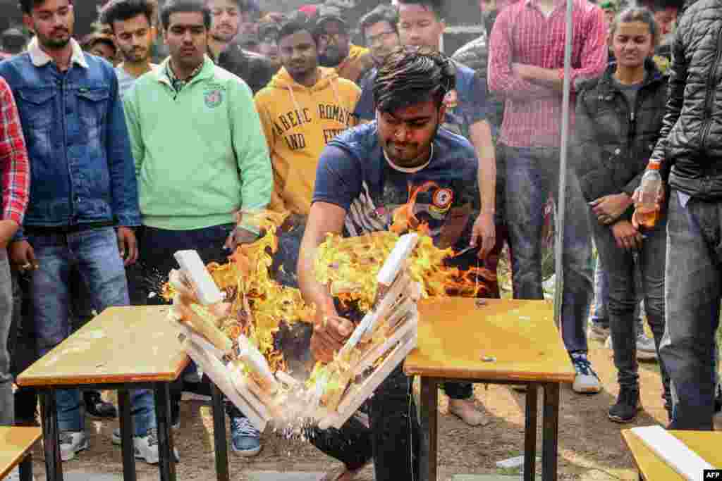 A student demonstrates his karate skills during the annual sports meeting at Shahzada Nand College ground in Amritsar, India.