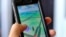 Pokemon Go is displayed on a cellphone in Los Angeles on Friday, July 8, 2016.