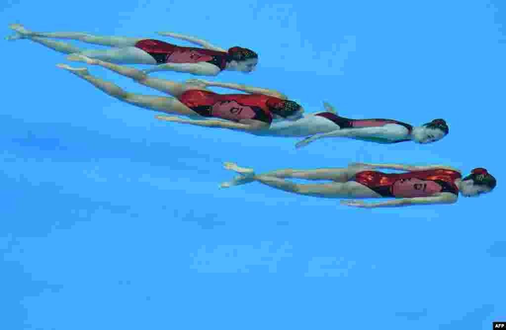 Japan&#39;s swimmers compete in the free combination synchronized swimming event final during the 2014 Asian Games at the Munhak Park Tae-hwan Aquatics Centre in Incheon, South Korea. 