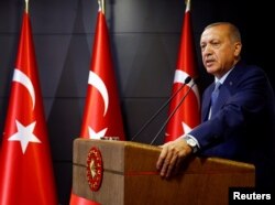 FILE - Turkish President Tayyip Erdogan, recently reelected to the presidency, but one with broader powers, speaks during a news conference in Istanbul, Turkey, June 24, 2018. (Kayhan Ozer/Presidential Palace/Handout via Reuters)