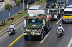 A convoy of coffins containing the remains of 24 Algerian resistance fighters killed during the French colonial conquest of the North African country, heads towards their final resting place at El Alia cemetery, in a suburb of Algiers, July 5, 2020.