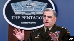 Joint Chiefs Chairman Gen. Mark Milley speaks at a press briefing at the Pentagon, Wednesday, July 21, 2021 in Washington. (AP Photo/Kevin Wolf)