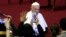 FILE - Pope Francis arrives in the Paul VI Hall at the Vatican for an audience with the participants in the 3rd International Meeting of Chorales, Nov. 24, 2018.
