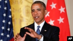 President Barack Obama answers questions during a joint news conference with Singapore's Prime Minister Lee Hsien Loong in the East Room of the White House in Washington, Aug. 2, 2016.