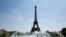 People cool themselves at the Trocadero Fountain in front of The Eiffel Tower in Paris on July 27, 2018, as a heat wave continues across northern Europe.