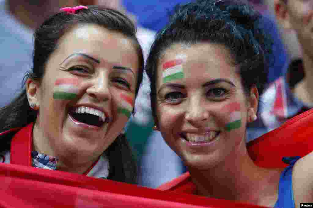 Hungary fans pose for pictures in their men's handball Preliminaries Group B match against Denmark at the Copper Box venue during the London 2012 Olympic Games July 29, 2012.