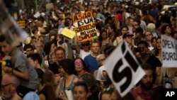 People march during a protest demanding the Spanish government fulfill its pledge to give shelter to refugees, in Madrid, June 17, 2017.