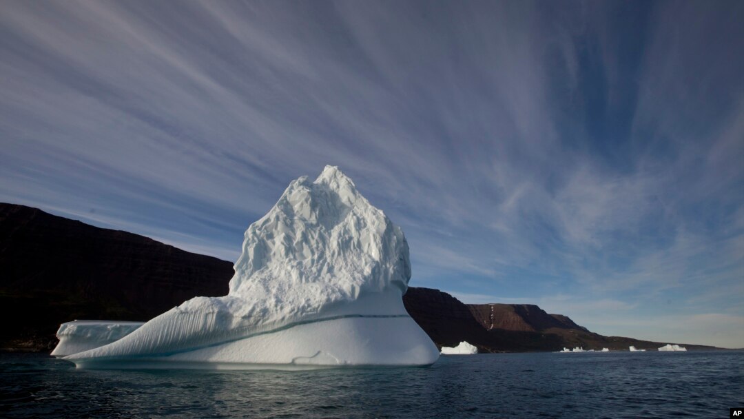 FILE - An iceberg floats in the sea near Qeqertarsuaq, Disko Island, Greenland, July 21, 2011. Levels of plastic found east of Greenland and in the Barents Sea off Norway and Russia were far higher than expected for the sparsely populated regions, according to a new report.