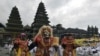 Artists perform Sidakarya mask dancing during mass prayers, expressing gratitude for the handling of the new coronavirus and seeking blessings for the start of a &quot;new normal&quot;, at Besakih temple in Karangasem, Bali, Indonesia.