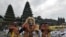 Artists perform Sidakarya mask dancing during mass prayers, expressing gratitude for the handling of the new coronavirus and seeking blessings for the start of a &quot;new normal&quot;, at Besakih temple in Karangasem, Bali, Indonesia.