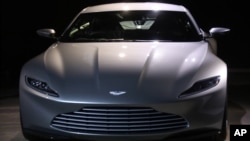 The Aston Martin DB10 is revealed at the announcement for the new Bond film, the 24th in the series, at Pinewood Studios in west London, Thursday, Dec. 4, 2014.