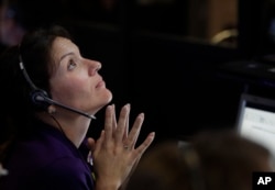 Engineer Mar Vaquero monitors the status of NASA's Cassini spacecraft as it enters the atmosphere of Saturn, in mission control at NASA's Jet Propulsion Laboratory, Sept. 15, 2017, in Pasadena, Calif.