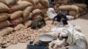 Potatoes to be sold in Jalalabad's main vegetable market are inspected and weighed, May 16, 2011.(Bethany Matta/VOA)