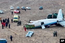 The wreckage of Azerbaijan Airlines Embraer 190 lays on the ground near the airport of Aktau, Kazakhstan, Dec. 25, 2024.