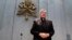 FILE - Cardinal George Pell arrives to make a statement, at the Vatican, June 29, 2017. 