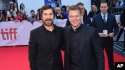 Christian Bale, left, and Matt Damon attend a premiere for "Ford v Ferrari" on day five of the Toronto International Film Festival at Roy Thomson Hall, Sept. 9, 2019, in Toronto.