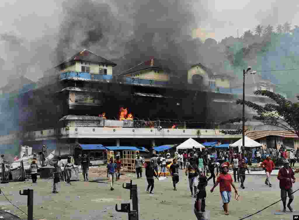 A local market is seen burning during a protest in Fakfak, Papua province. Indonesia sent over 1,000 security personnel to the province of West Papua in answer to spreading violent protests that began with accusations that security forces had arrested and insulted Papuan students in East Java.