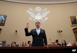 Michael Cohen, President Donald Trump's former personal lawyer, is sworn in to testify before the House Oversight and Reform Committee on Capitol Hill in Washington, Feb. 27, 2019.