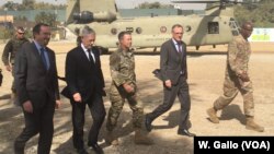 Defense Secretary Jim Mattis, second left, arrives at Resolute Support headquarters in Kabul, Afghanistan, Sept. 7, 2018.
