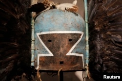 An antique tribal mask, Tumas Crow Mother, circa 1880, is displayed at an auction house in Paris, April 11, 2013.