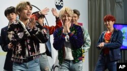 BTS poses in the press room at the American Music Awards at the Microsoft Theater, Nov. 19, 2017, in Los Angeles. 