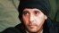 FILE - Hannibal Gadhafi, son of late Libyan leader Moammar Gadhafi, watches an elite military unit exercise in Zlitan, Libya, in this undated file photo made available Sept. 25, 2011.