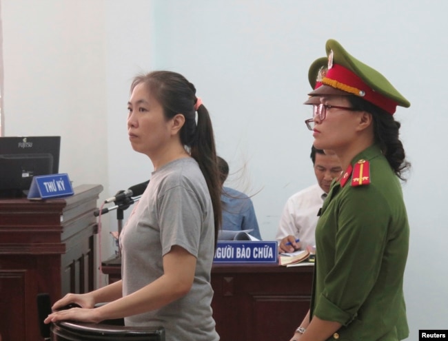 FILE - Prominent blogger Nguyen Ngoc Nhu Quynh, also known as Mẹ Nấm, or Mother Mushroom, stands trial in Vietnam, June 29, 2017. She was accused of distorting government policies and defaming the Communist regime on her Facebook posts.