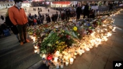Candles and flowers placed in central Stockholm to commemorate the victims of last Friday's terror attack in the city, in Stockholm, Sweden, April 9, 2017. 