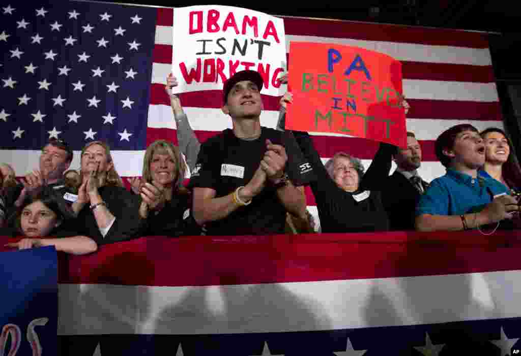 Supporters of Republican presidential candidate, former Massachusetts Gov. Mitt Romney cheer as he addresses a crowd at a campaign event, in Broomall, Pennsylvania, April 4, 2012. (AP)