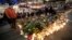 FILE - Candles and flowers placed in central Stockholm to commemorate the victims of the April 7, 2017, terror attack in the city, in Stockholm, Sweden, April 9, 2017. 