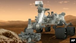 Gambaran kendaraan penjelajah NASA, Curiosity, di permukaan Mars. 