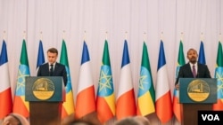 Ethiopia's Prime Minister Abiy Ahmed and French President Emmanuel Macron during a press conference at the newly renovated Ethiopia's National Palace in Addis Ababa on Dec. 21, 2024.